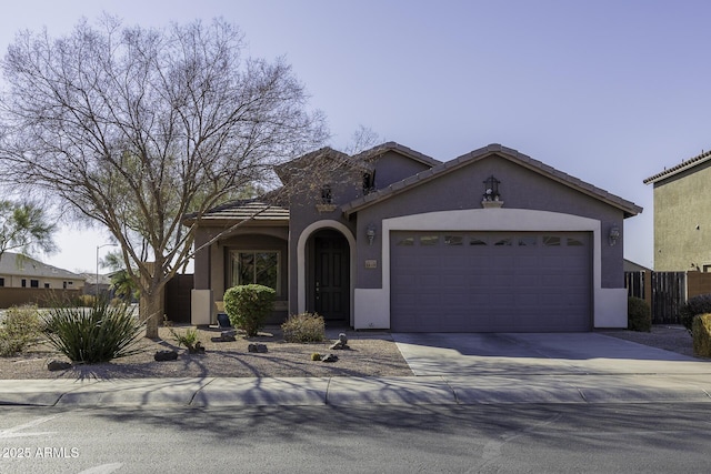 mediterranean / spanish-style home with a garage