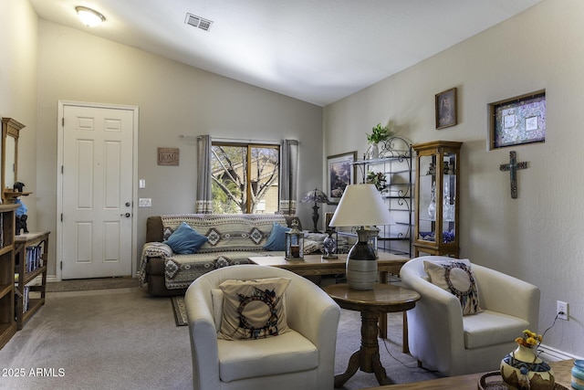 carpeted living room with lofted ceiling