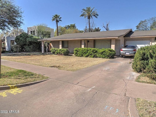 ranch-style house featuring a garage