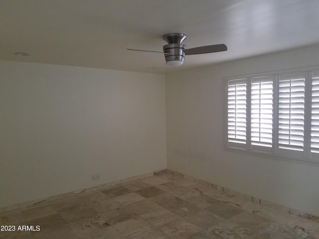 empty room featuring ceiling fan