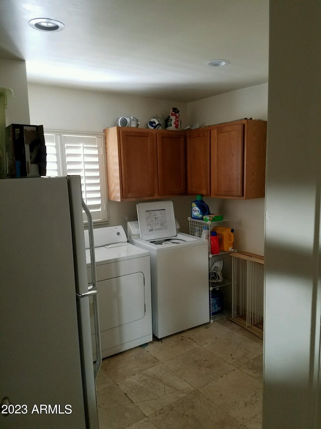 laundry area with separate washer and dryer