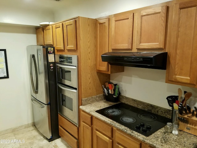 kitchen with ventilation hood, stainless steel appliances, and light stone counters