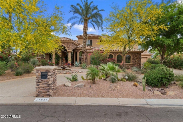 11821 S Tuzigoot Ct, Phoenix, AZ 85044 - mediterranean / spanish-style home with a tiled roof and stucco siding
