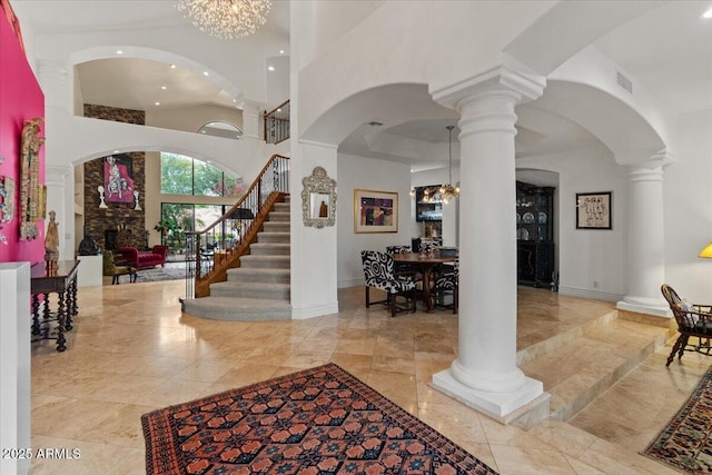 11821 S Tuzigoot Ct, Phoenix, AZ 85044 - entrance foyer featuring visible vents, a notable chandelier, decorative columns, recessed lighting, and a towering ceiling