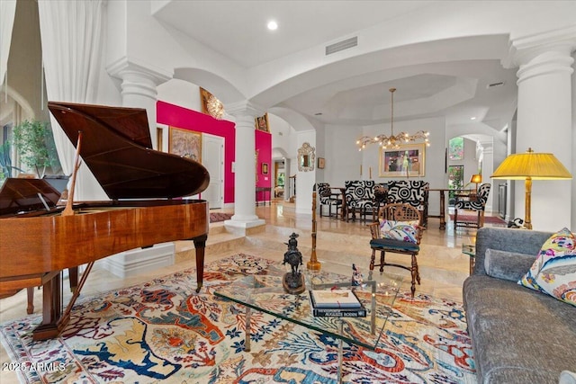 11821 S Tuzigoot Ct, Phoenix, AZ 85044 - interior space featuring visible vents, ornate columns, arched walkways, and an inviting chandelier
