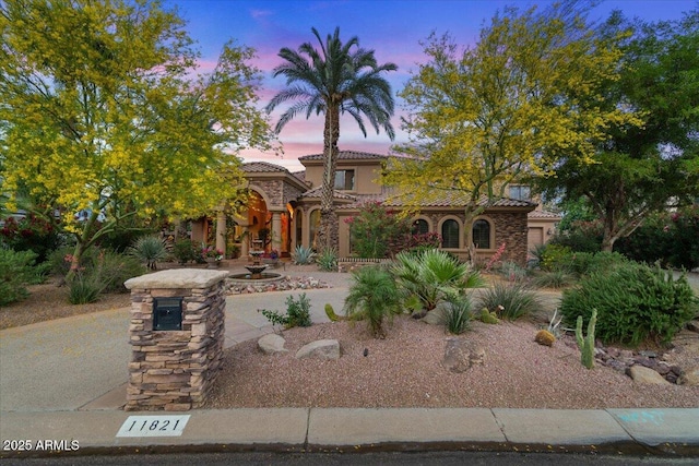 11821 S Tuzigoot Ct, Phoenix, AZ 85044 - mediterranean / spanish home featuring a tiled roof and stucco siding