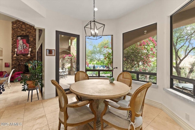 11821 S Tuzigoot Ct, Phoenix, AZ 85044 - dining area with light tile patterned floors and an inviting chandelier