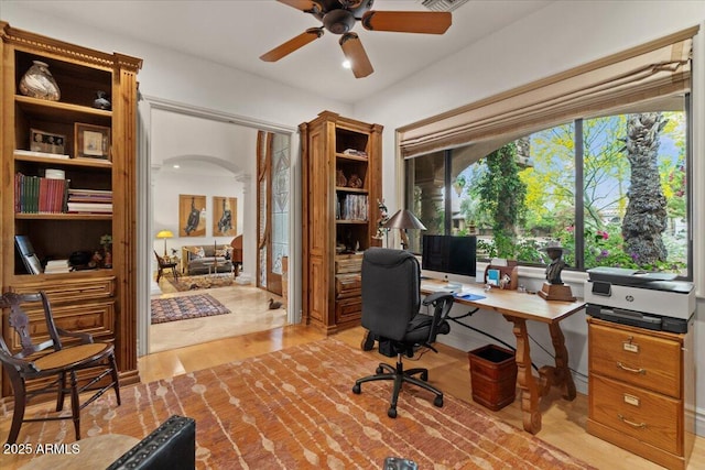 11821 S Tuzigoot Ct, Phoenix, AZ 85044 - office area featuring light wood-type flooring, a ceiling fan, and arched walkways