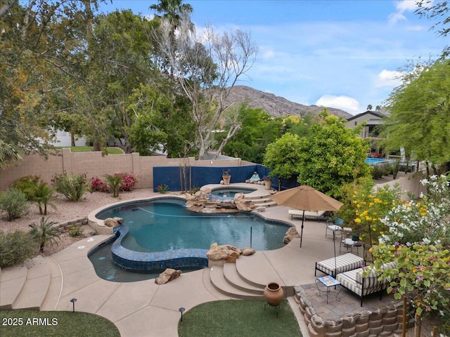 11821 S Tuzigoot Ct, Phoenix, AZ 85044 - view of swimming pool with a patio, a mountain view, a fenced backyard, and an in ground hot tub