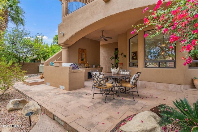 11821 S Tuzigoot Ct, Phoenix, AZ 85044 - view of patio featuring fence, a balcony, a ceiling fan, and outdoor dining space