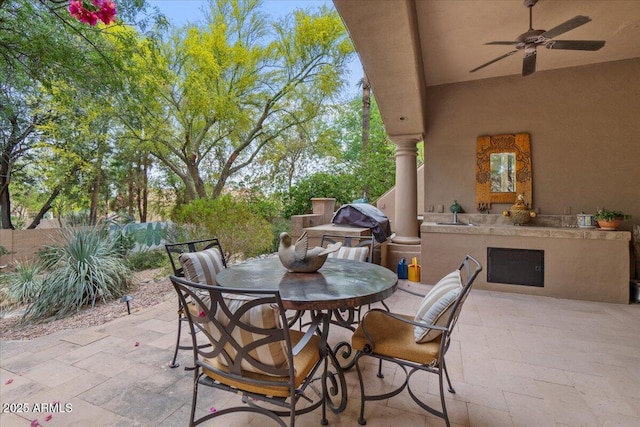 11821 S Tuzigoot Ct, Phoenix, AZ 85044 - view of patio / terrace with exterior kitchen, outdoor dining area, a grill, and ceiling fan