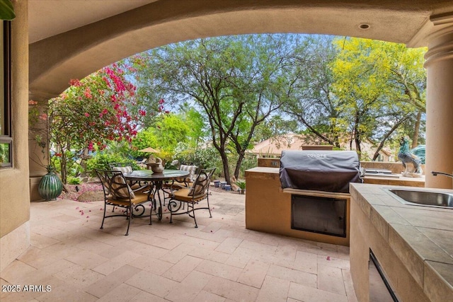 11821 S Tuzigoot Ct, Phoenix, AZ 85044 - view of patio featuring outdoor dining area and area for grilling