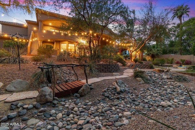 11821 S Tuzigoot Ct, Phoenix, AZ 85044 - back of property at dusk featuring a tiled roof and stucco siding
