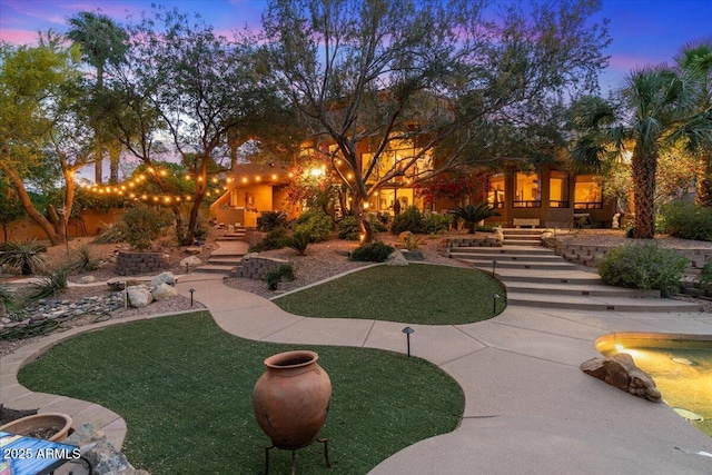 11821 S Tuzigoot Ct, Phoenix, AZ 85044 - view of yard at dusk