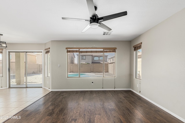 3910 W Goldmine Mountain Dr, San Tan Valley, AZ 85144 - spare room featuring wood finished floors and ceiling fan