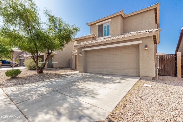 3910 W Goldmine Mountain Dr, San Tan Valley, AZ 85144 - view of front of house featuring stucco siding, driveway, a tiled roof, and a gate