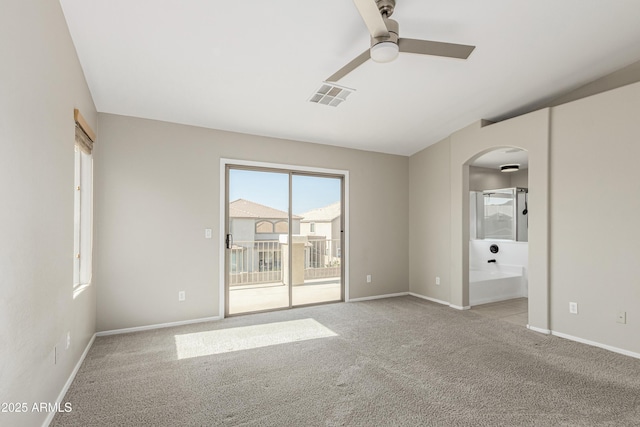 3910 W Goldmine Mountain Dr, San Tan Valley, AZ 85144 - unfurnished room with arched walkways, ceiling fan, and carpet