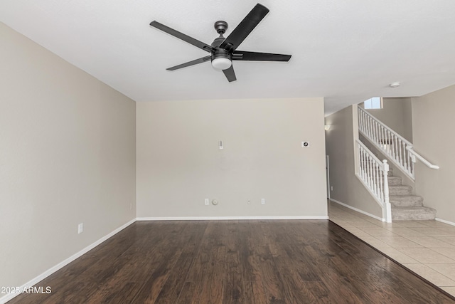 3910 W Goldmine Mountain Dr, San Tan Valley, AZ 85144 - empty room with a ceiling fan, stairway, and wood finished floors