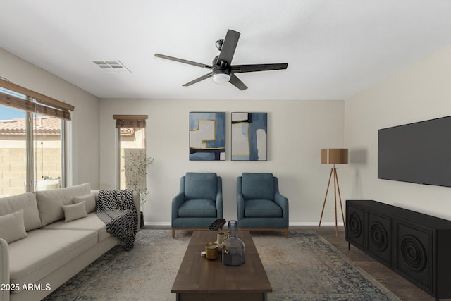 3910 W Goldmine Mountain Dr, San Tan Valley, AZ 85144 - living area featuring a ceiling fan and baseboards