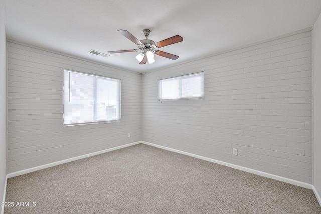 unfurnished room with visible vents, carpet, and baseboards
