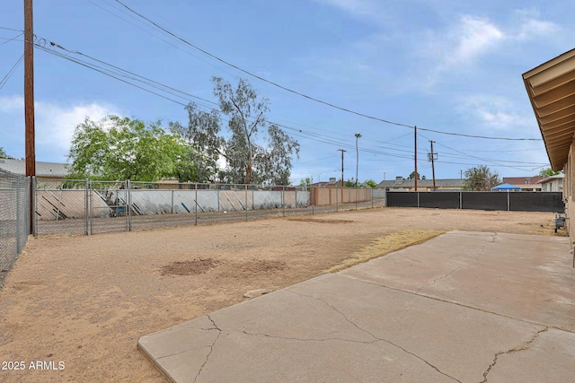 view of yard featuring a patio and a fenced backyard
