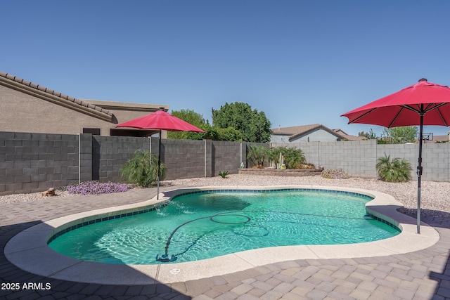 view of swimming pool with a fenced in pool and a fenced backyard