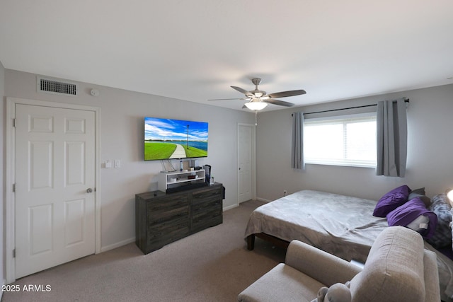 carpeted bedroom featuring visible vents, ceiling fan, and baseboards