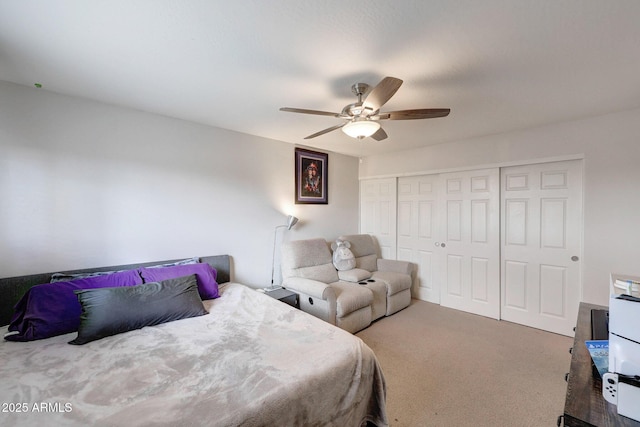 carpeted bedroom featuring a closet and ceiling fan