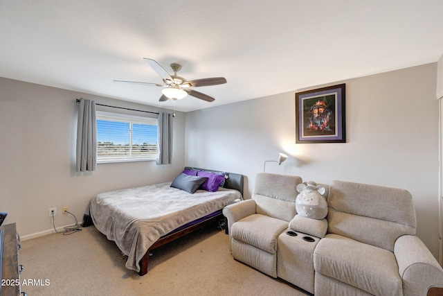 carpeted bedroom featuring ceiling fan and baseboards