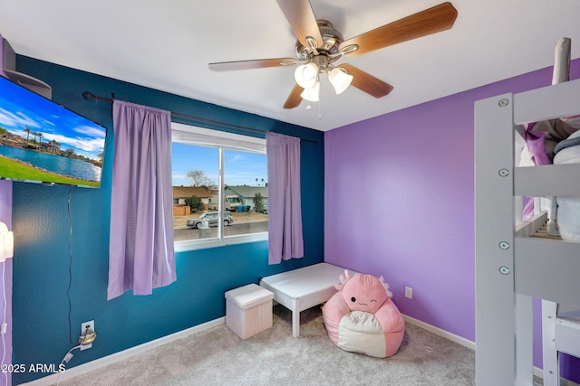 bedroom featuring carpet floors, baseboards, and a ceiling fan