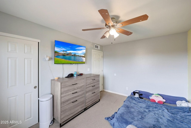 bedroom featuring visible vents, ceiling fan, light carpet, and baseboards