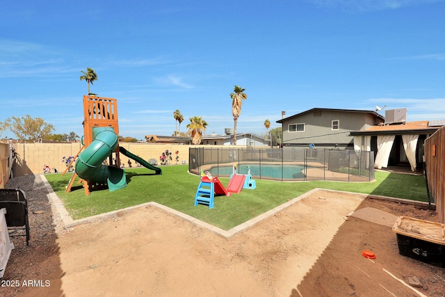 view of play area featuring a lawn, a fenced backyard, and a fenced in pool