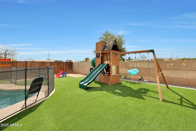 view of jungle gym with a fenced backyard and a lawn