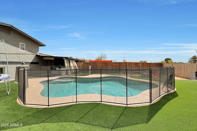 view of pool featuring a patio, a lawn, a fenced backyard, and a fenced in pool