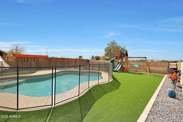 view of pool with a fenced backyard, a playground, and a fenced in pool