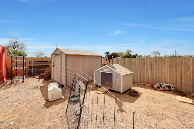 view of shed featuring a fenced backyard