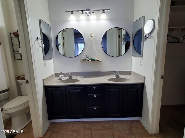 2101 S Meridian Rd Unit 437, Apache Junction, AZ 85120 - bathroom featuring double vanity, tile patterned floors, and toilet