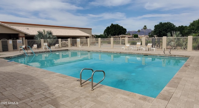 2101 S Meridian Rd Unit 437, Apache Junction, AZ 85120 - community pool featuring a mountain view and a patio area