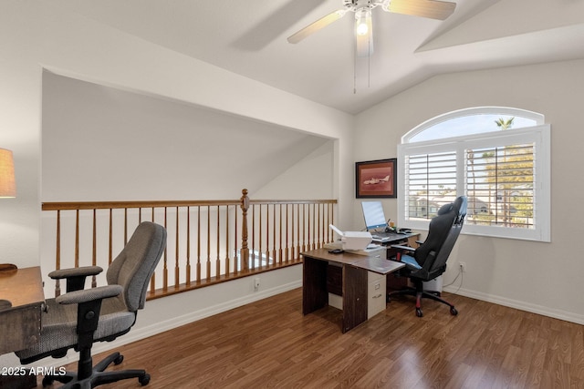 home office featuring dark wood-style floors, vaulted ceiling, baseboards, and ceiling fan