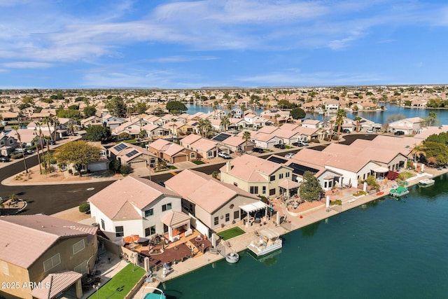 birds eye view of property featuring a residential view and a water view