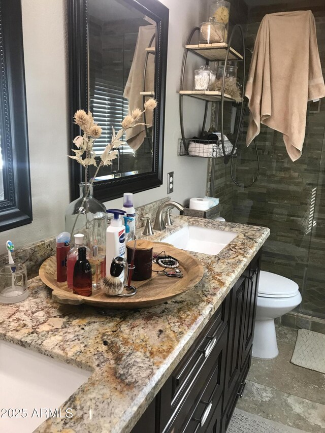 5110 E Mark Ln, Cave Creek, AZ 85331 - bathroom featuring toilet, double vanity, and a tile shower