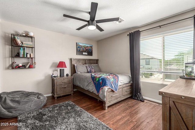 5110 E Mark Ln, Cave Creek, AZ 85331 - bedroom featuring dark wood-style floors, baseboards, ceiling fan, and a textured ceiling