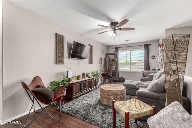 5110 E Mark Ln, Cave Creek, AZ 85331 - living area with a ceiling fan, dark wood-type flooring, baseboards, and a textured ceiling