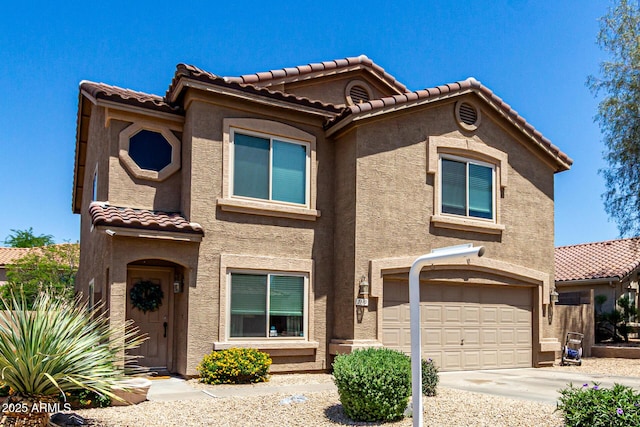 5110 E Mark Ln, Cave Creek, AZ 85331 - mediterranean / spanish house featuring a tile roof, stucco siding, an attached garage, and driveway