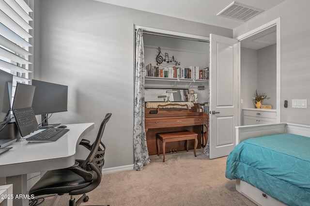 bedroom with baseboards, visible vents, and carpet