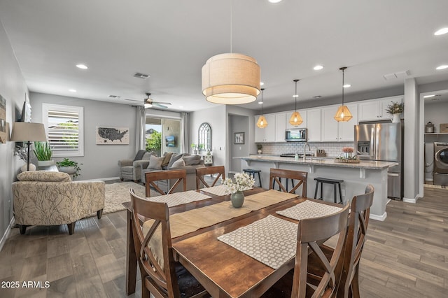 dining area with baseboards, dark wood-style flooring, visible vents, and recessed lighting