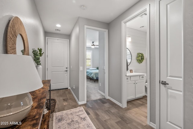 interior space with dark wood-style floors, visible vents, baseboards, recessed lighting, and a ceiling fan