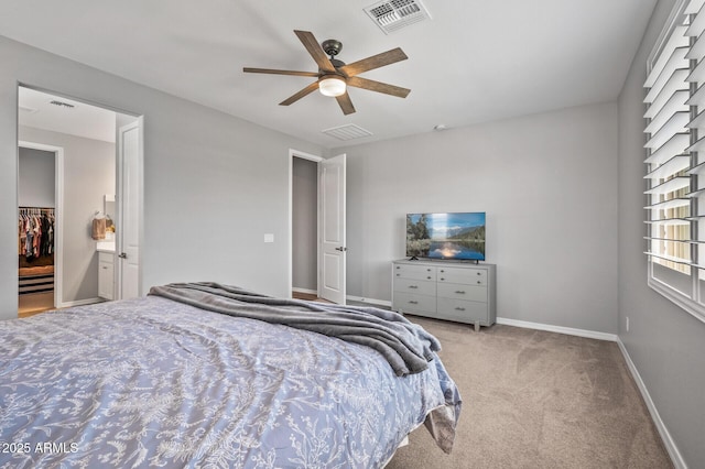 carpeted bedroom with baseboards, visible vents, and ceiling fan
