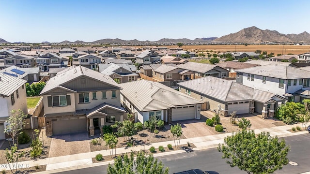 drone / aerial view with a mountain view and a residential view