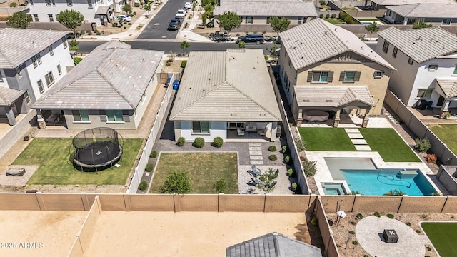 birds eye view of property with a residential view